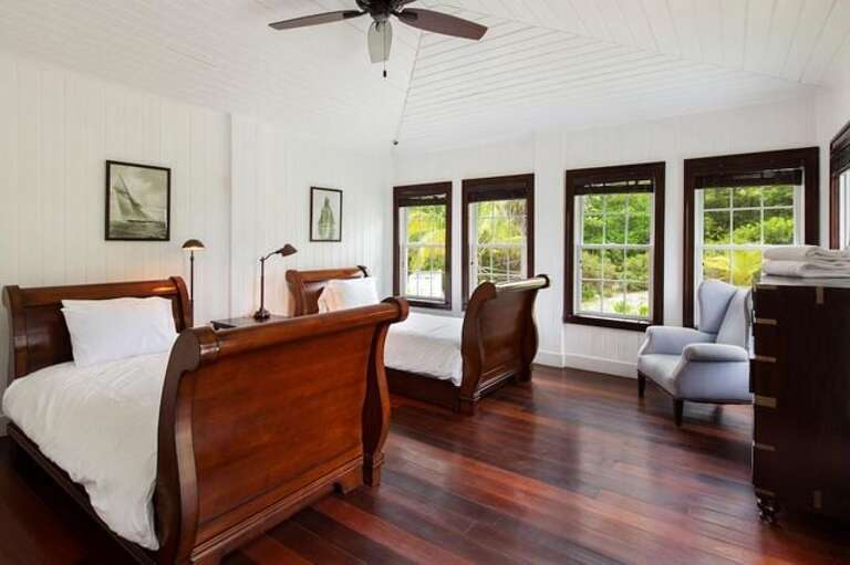 Main House guest bedroom suite with twin beds and two trundle beds, and en suite bath