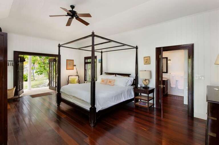 Main House master bedroom suite with king bed and en suite bath.