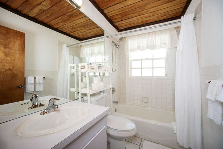 Bathroom with shower and tub combination.