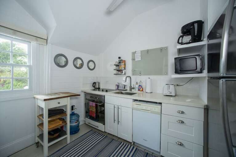 The kitchen is fully equipped for cooking and dining.