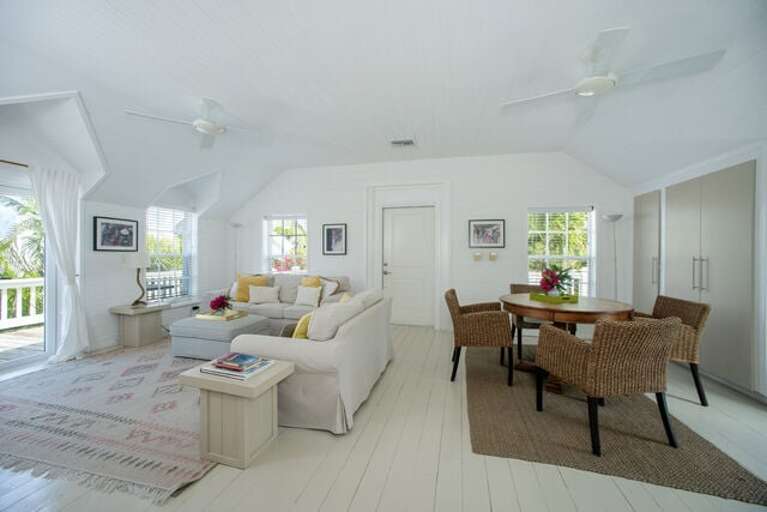 Open-plan living and dining area with French doors to the wrap-around veranda.