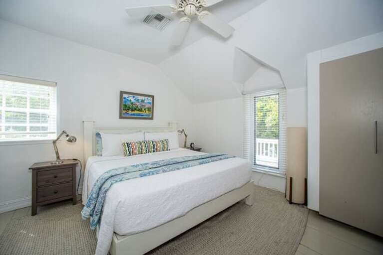 The spacious master bedroom, which also has a door to the veranda, has a king bed and an en suite bath with a walk-in shower.