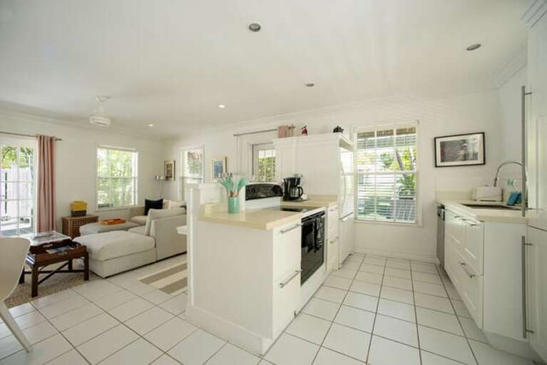 The kitchen is fully equipped for cooking and dining in.