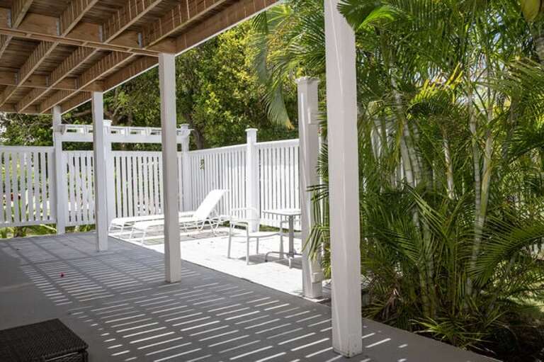 Patio with lounge chairs and table.