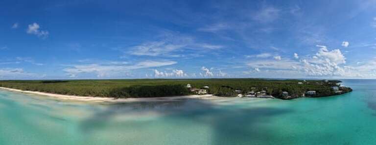 Ten Bay Beach with Southern Comfort in the background.