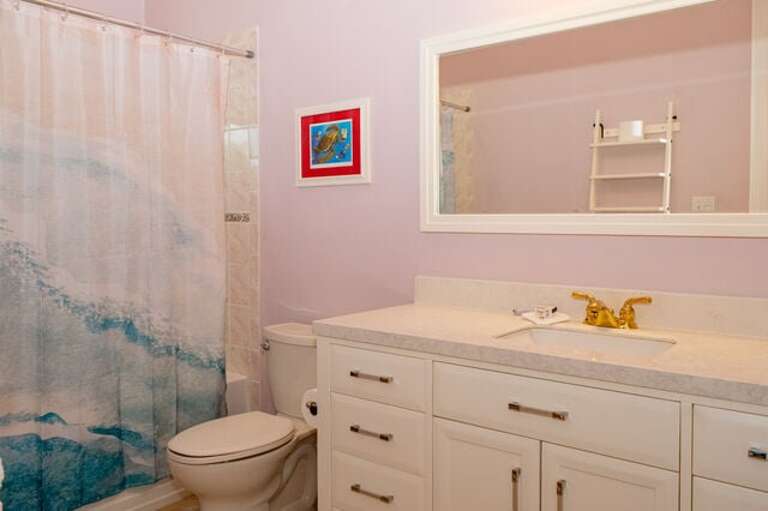 Bath with walk-in shower.