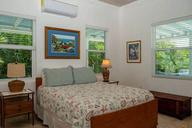 Bedroom Three with queen size bed and an ensuite full bath.