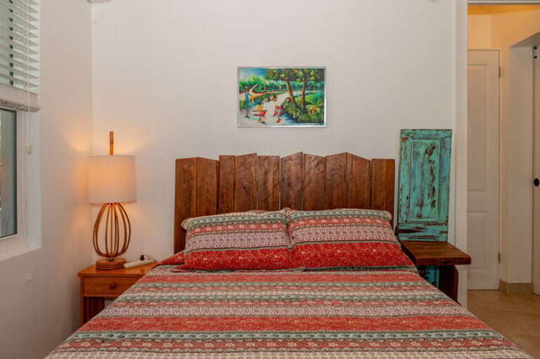 Bedroom Four with queen size bed and an ensuite full bath.