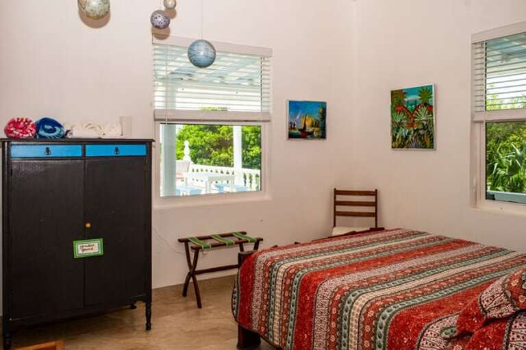 Bedroom Four has a view of the pool