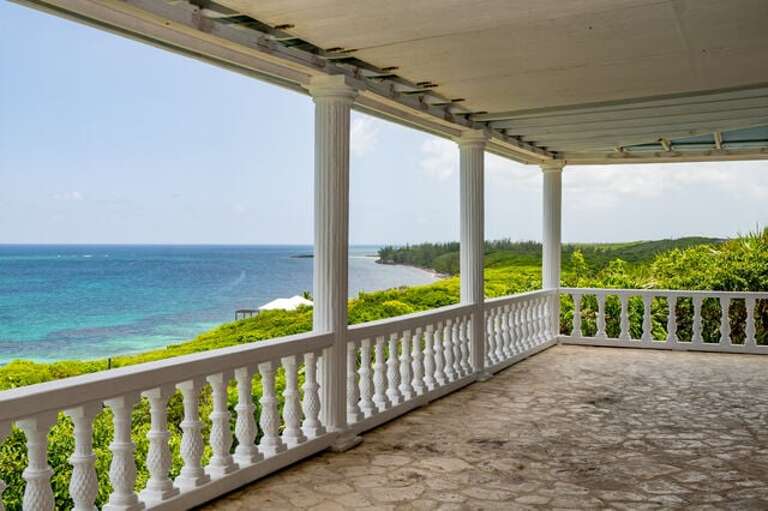 Covered porch with panoramic ocean views.