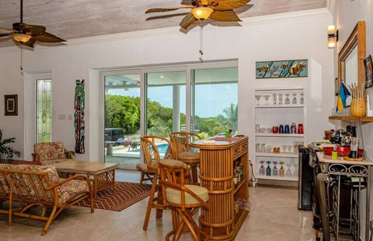 Wet bar with a mini fridge for beer, wine, and soft drinks.