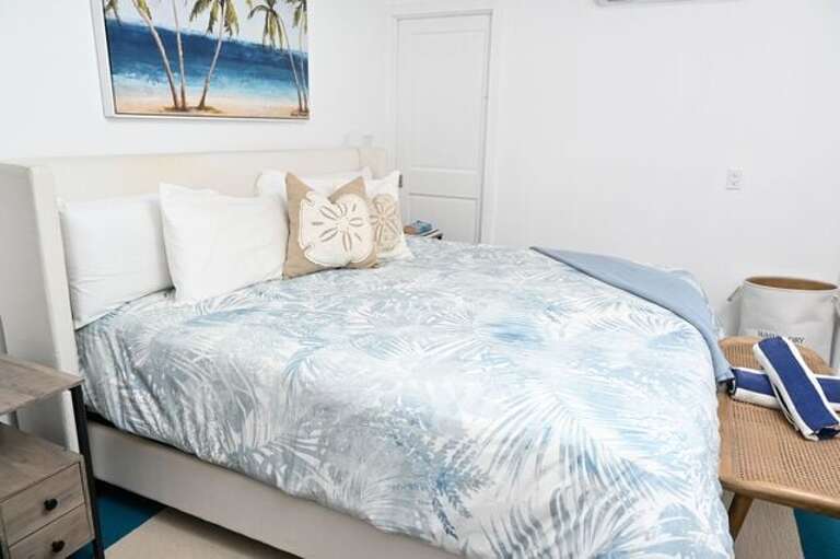 Bedroom One has a king bed and an en-suite full bath with an oversized walk-in shower.