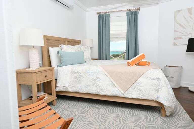 Bedroom Two has a queen bed and an ocean view, and has access to the second full bath off the hall.