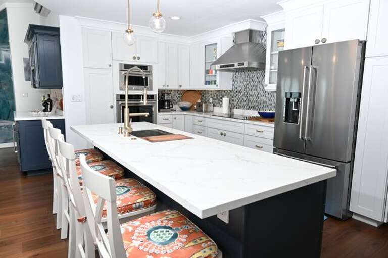 The chef's kitchen, which also enjoys ocean views, is finished in white quartz and stainless steel.