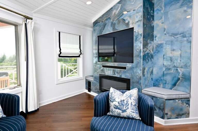 Enjoy our entertainment center with 65" Samsung smart TV, sound bar, and electric fireplace.