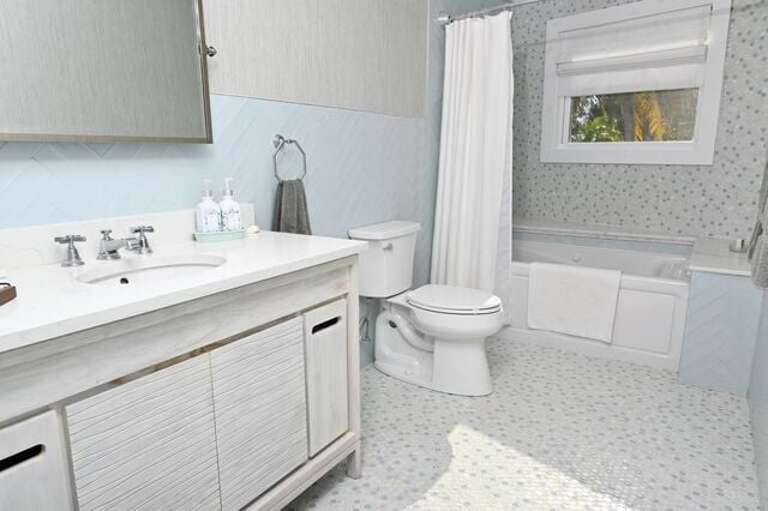 The second full bath features a shower-tub combination with a jetted spa tub.