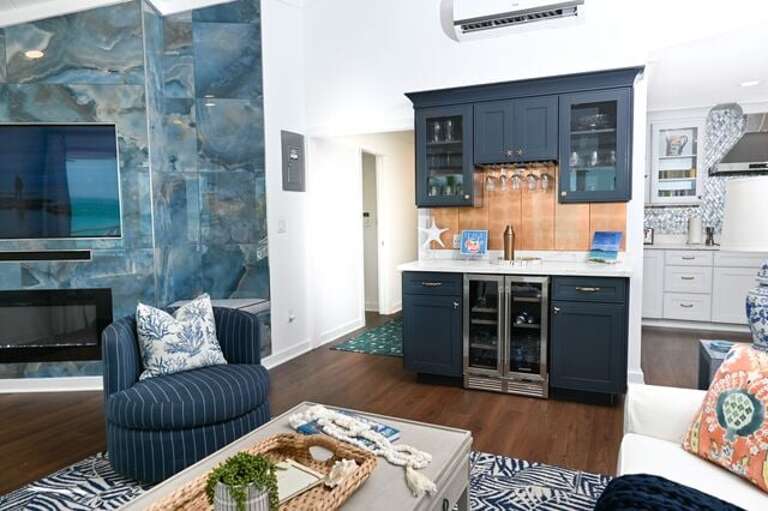 Fully equipped bar area with a beer and wine cooler.