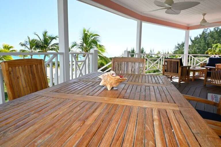 Ocean-view veranda with outdoor dining table for six.