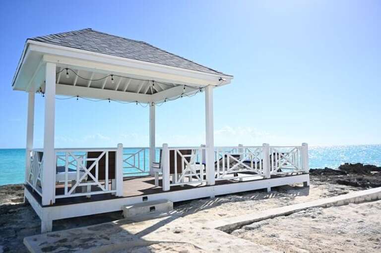 Our private beachfront features a shady gazebo with oceanfront seating.