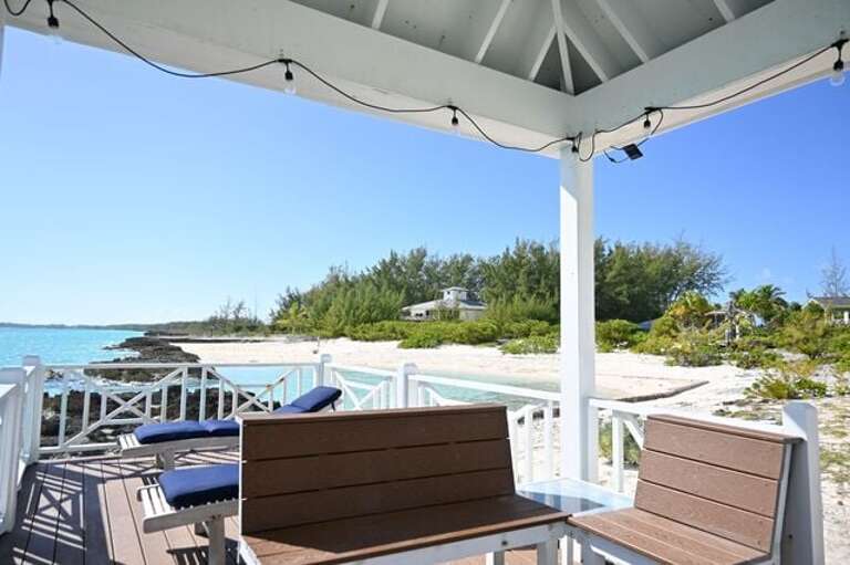 A shady gazebo with oceanfront seating.