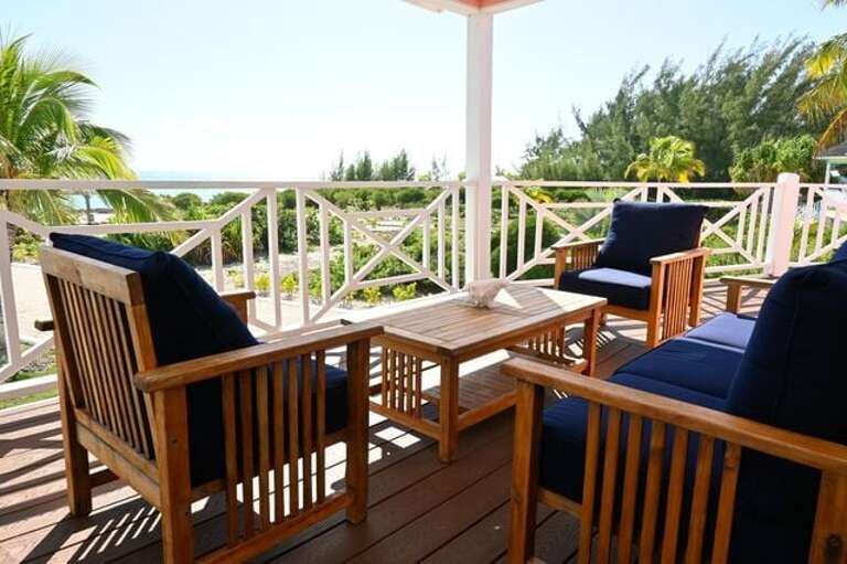 The veranda is also furnished for lounging with a sofa and chairs.