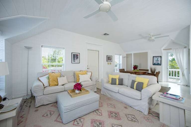Peach Cottage upstairs open-plan living and dining area with French doors to the wrap-around veranda.