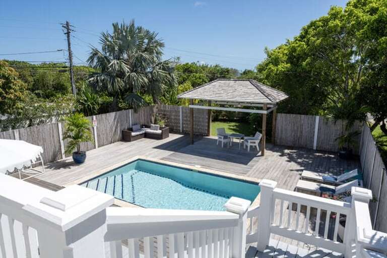 The pool area is surrounded by lush landscaping and shaded seating.  Our pool can be heated for a charge of $50 per day.
