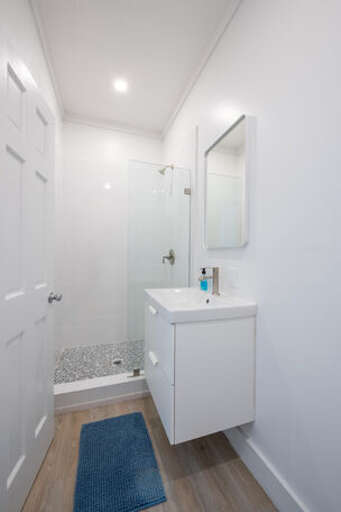Bath with walk-in shower.Bath with walk-in shower.