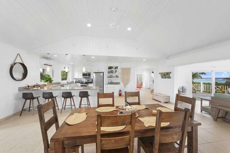 Dining area with ocean views and seating for six.