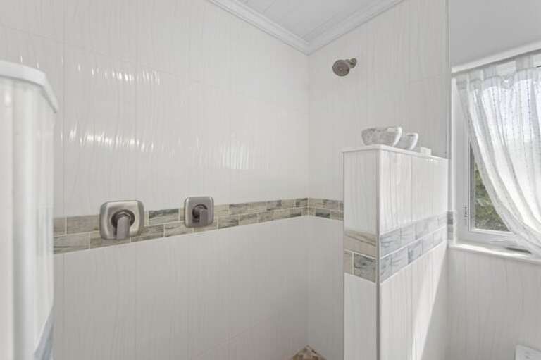 En-suite full bath with walk-in shower.