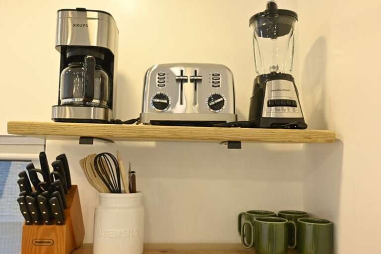 Other appliances include a coffee maker, blender, toaster, and more.