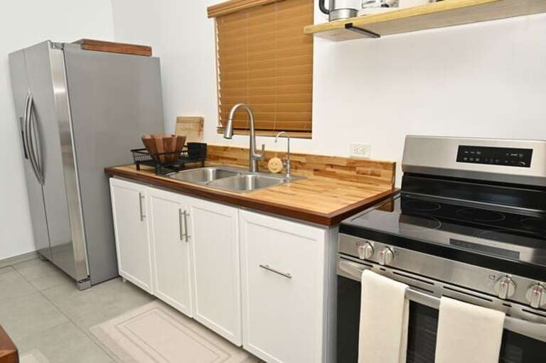 Other appliances include a coffee maker, blender, toaster, and more.