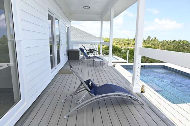 Covered porch with lounge seating.