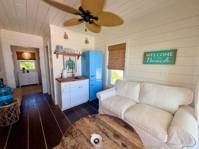 Comfortable living area with a small kitchenette stocked with the essentials for simple meals.