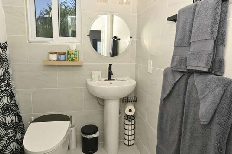 Full bath with walk-in shower and bidet.