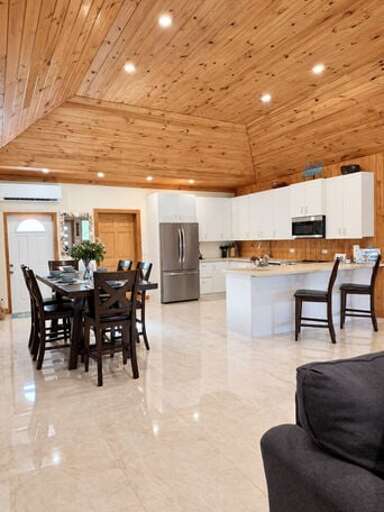 Luxurious kitchen finished in quartz and stainless steel.