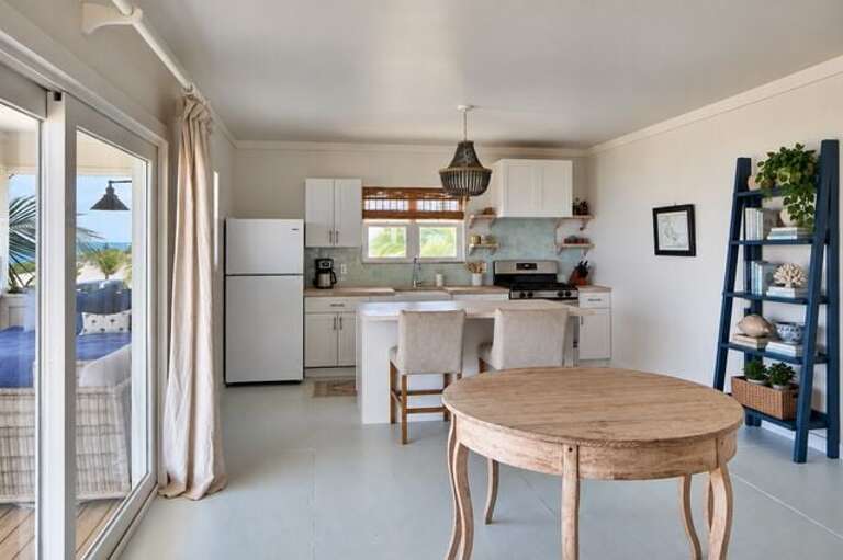 Fully equipped kitchen and dining with sea views.