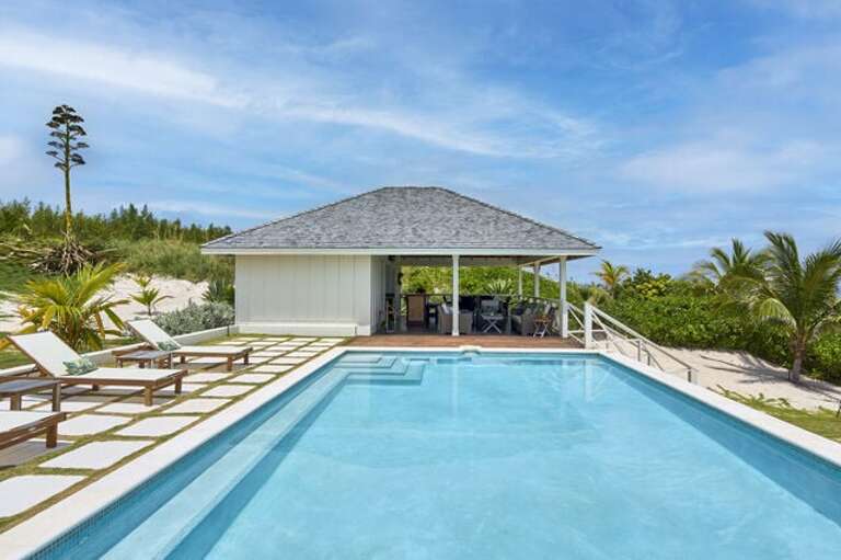 Relax by our extra-large pool,  the pool house has one public restroom and washers/dryers for guests.