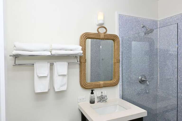 Bunk room en-suite bath with walk-in shower.