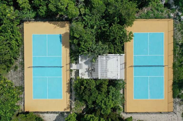 Our two private pickleball courts with a shaded seating area in between.