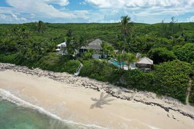 Welcome to Seashine, a private beachfront estate with heated pool, spa, and two pickleball courts.  Located directly on spectacular Twin Coves Beach.