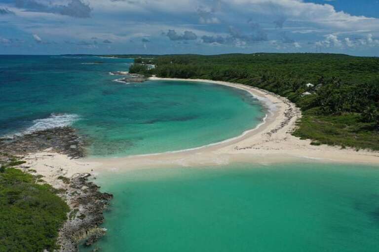 Twin Coves Beach with Seashine Estate in the distance, at right.