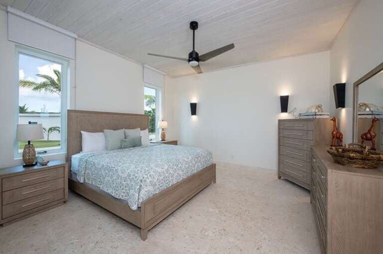 Third bedroom with king bed and garden view.