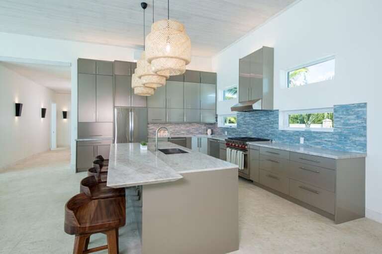 Fully equipped chef's kitchen with appliances by Subzero and Wolf.