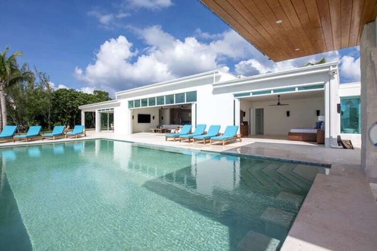 Sunset Dreams main house with great room and master bedroom glass walls retracted.