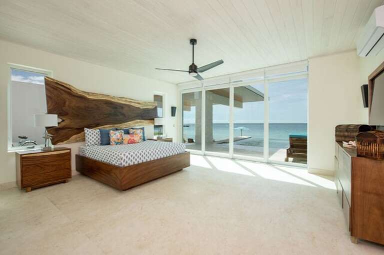 Master bedroom with king bed, huge en-suite bath, and ocean view.