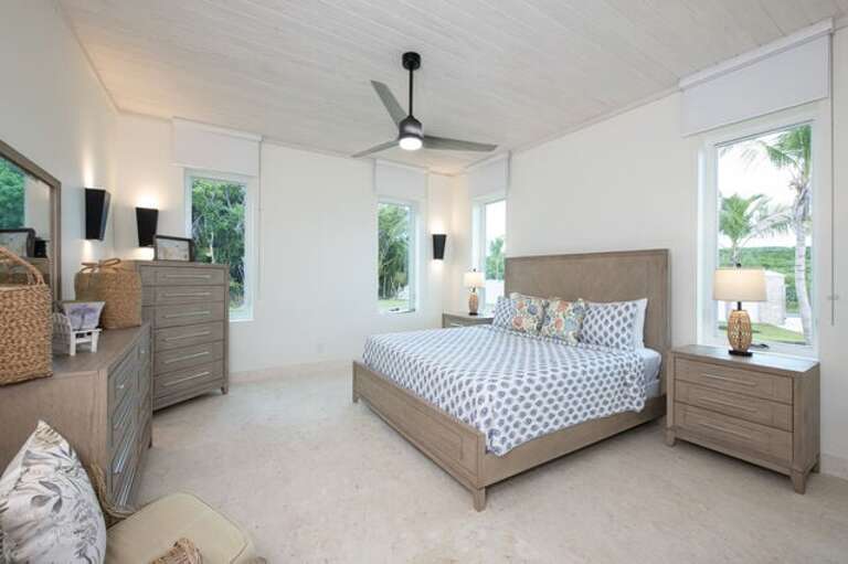 Second bedroom with king bed and garden view.