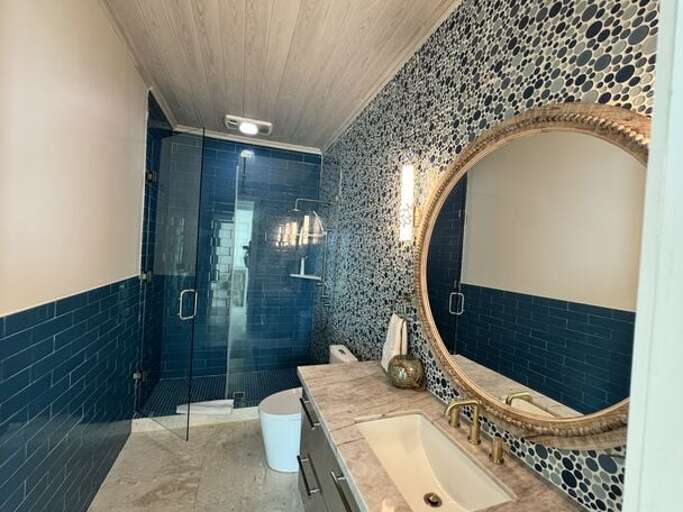 Guest cottage shared full bath with walk-in shower.