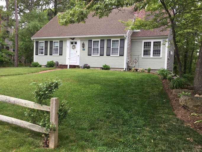 Single-story House With Lush Lawn And Leafy Landscape