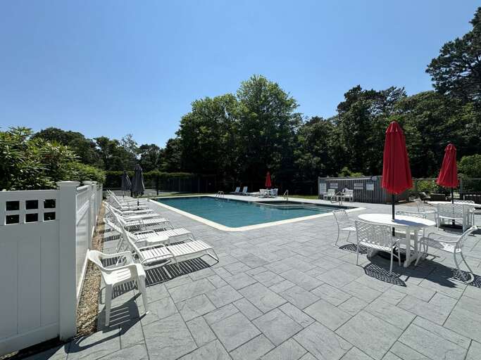 Poolside Paradise, Pristine Patio, Sunlit Setting With Scarlet Umbrellas